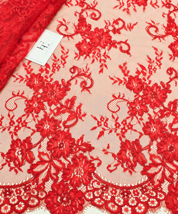 Red Chantilly lace fabric