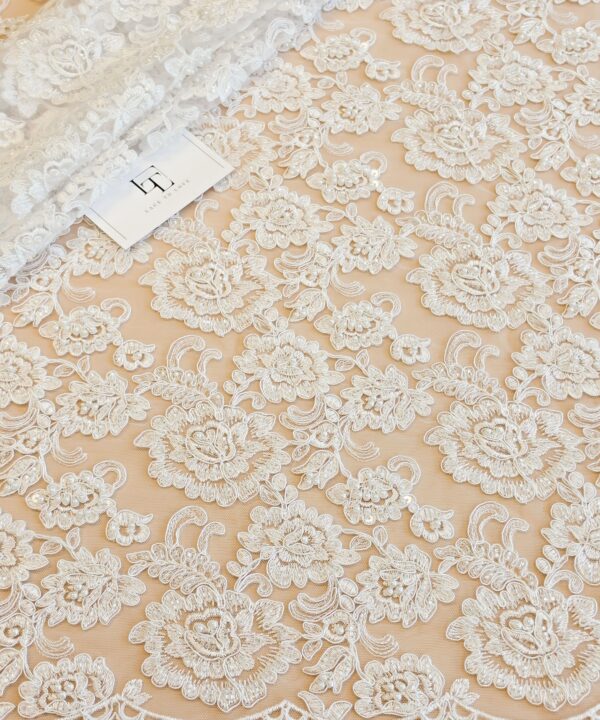 Optical white embroidered lace fabric