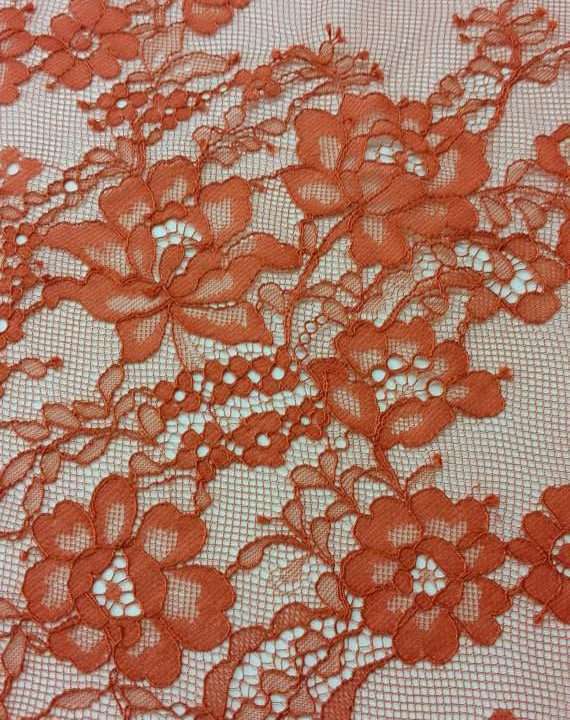 Delicate red orange lace fabric