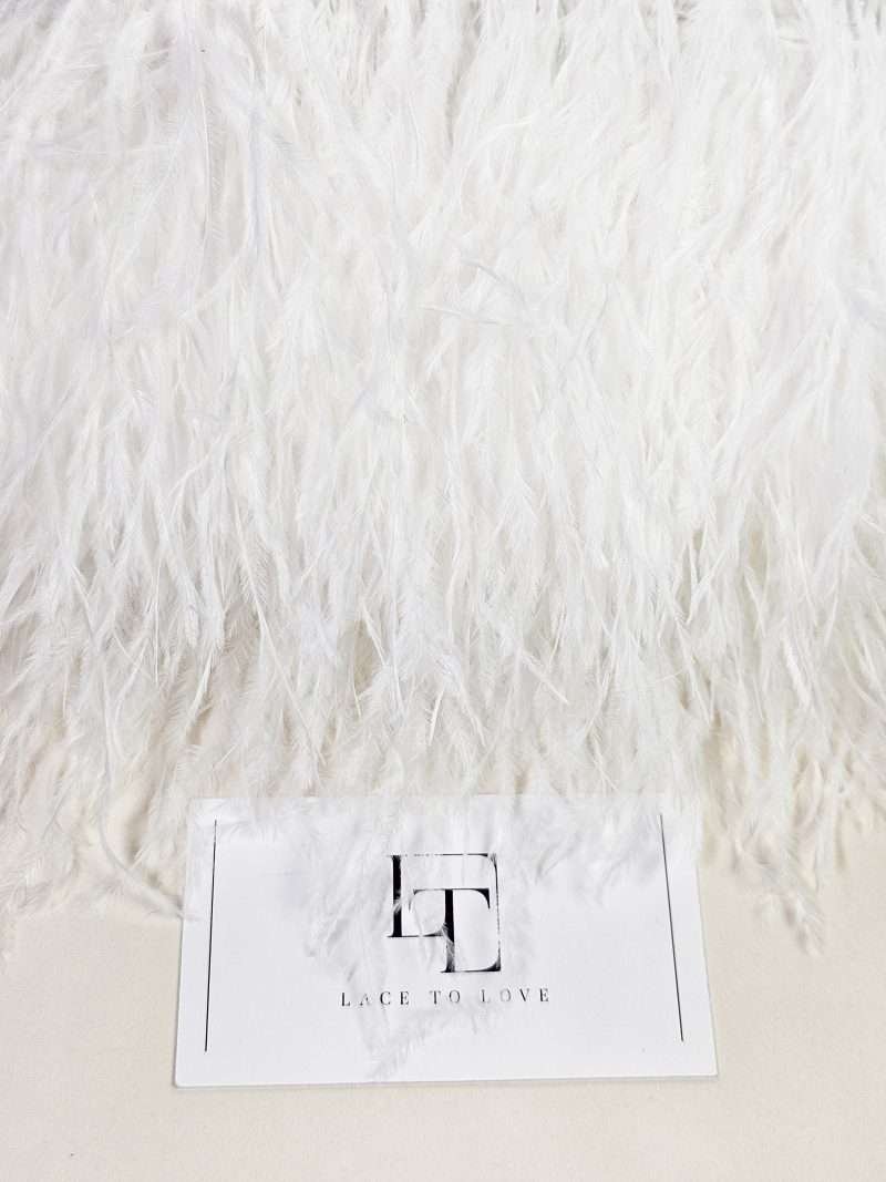 Pure white ostrich feather fringe on a ribbon