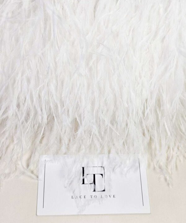 Pure white ostrich feather fringe on a ribbon