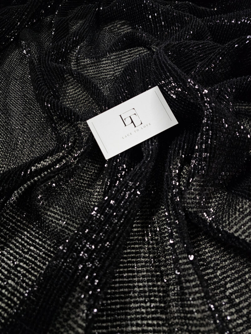 Black pleated tulle fabric embroidered with sequins