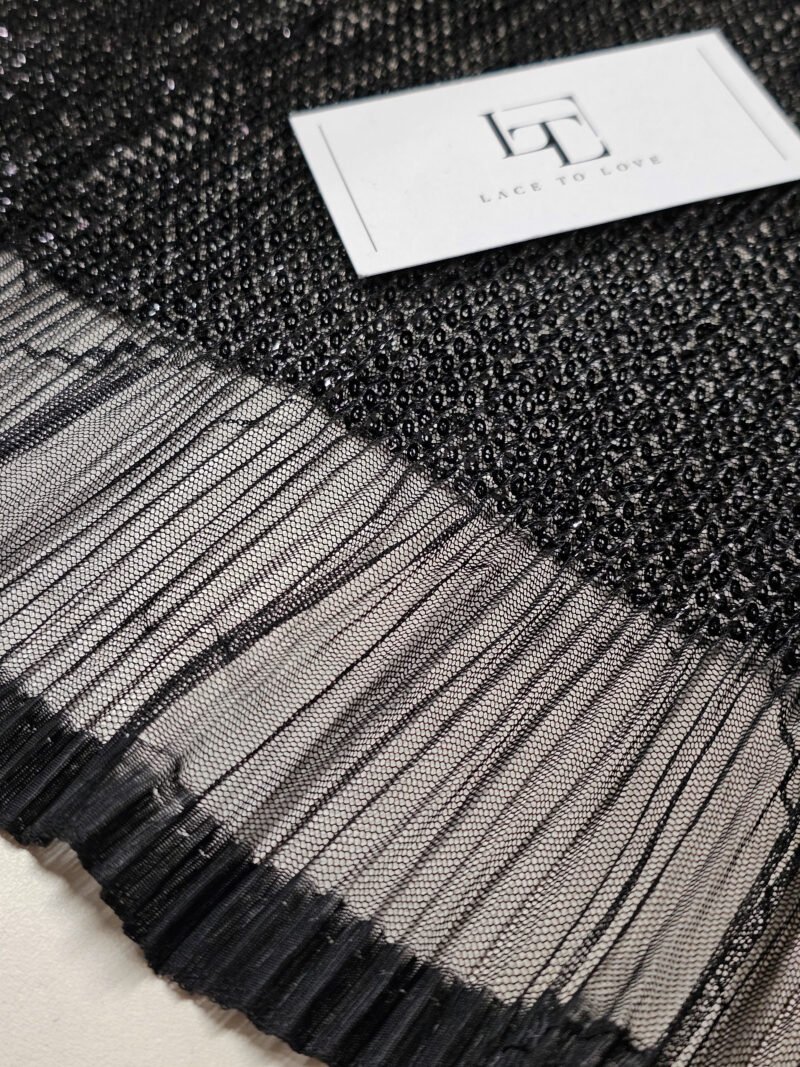 Black tulle fabric folded