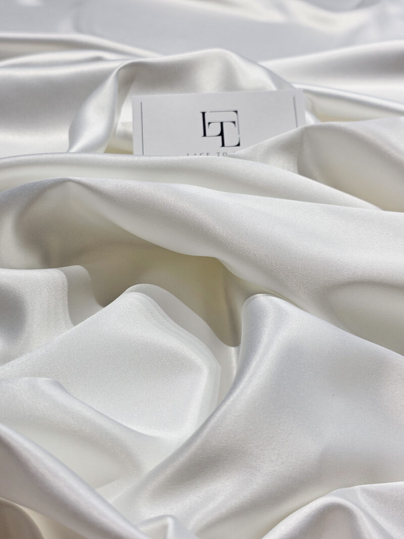 Ivory elastic stretch satin fabric