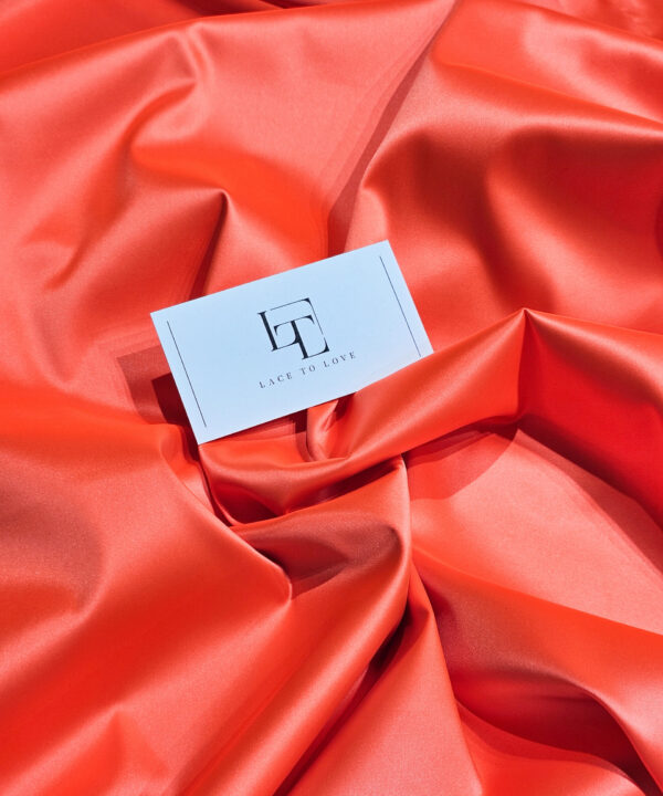 Orange elastic stretch satin fabric