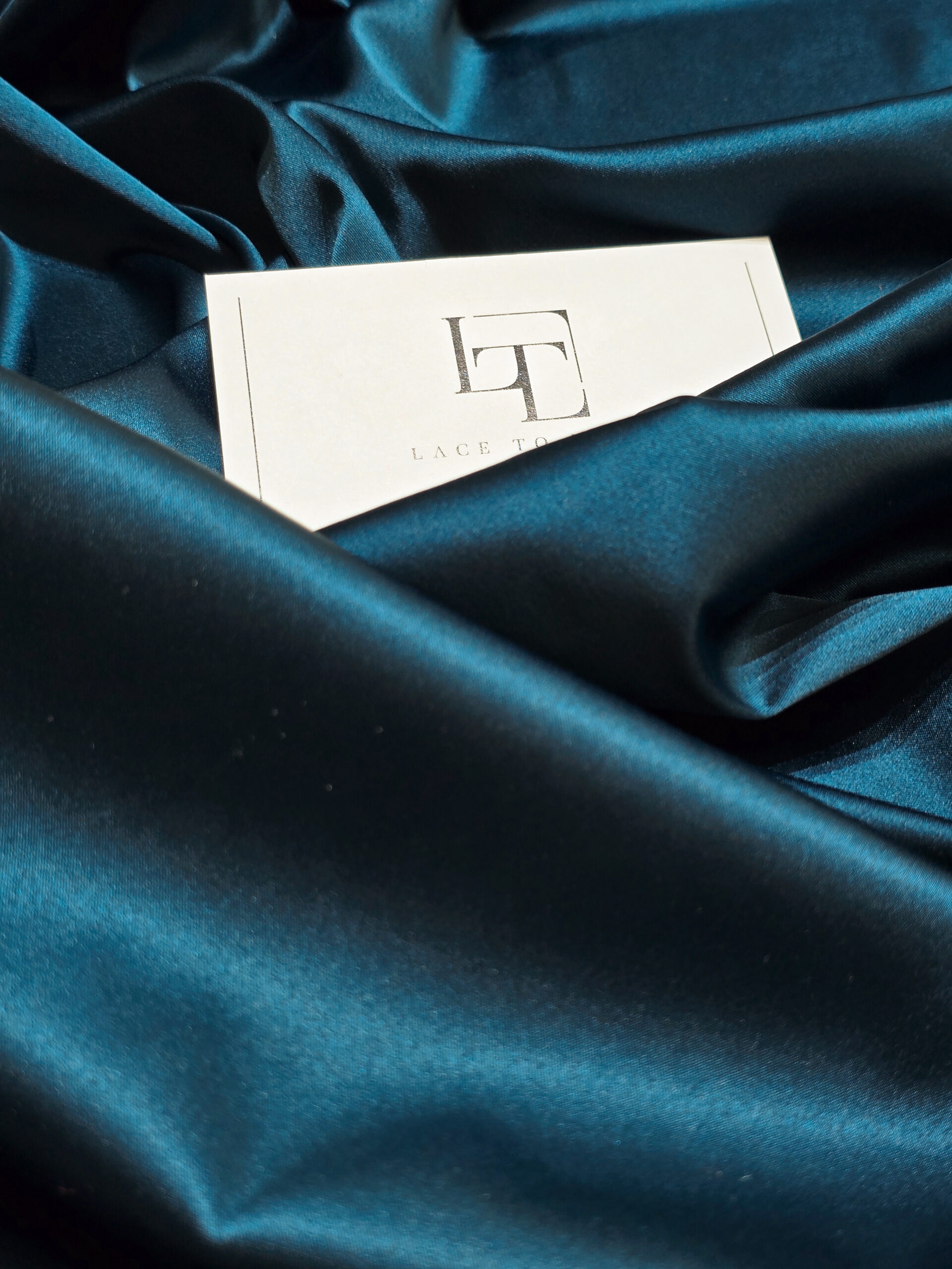 Vibrant green satin fabric for dresses gowns