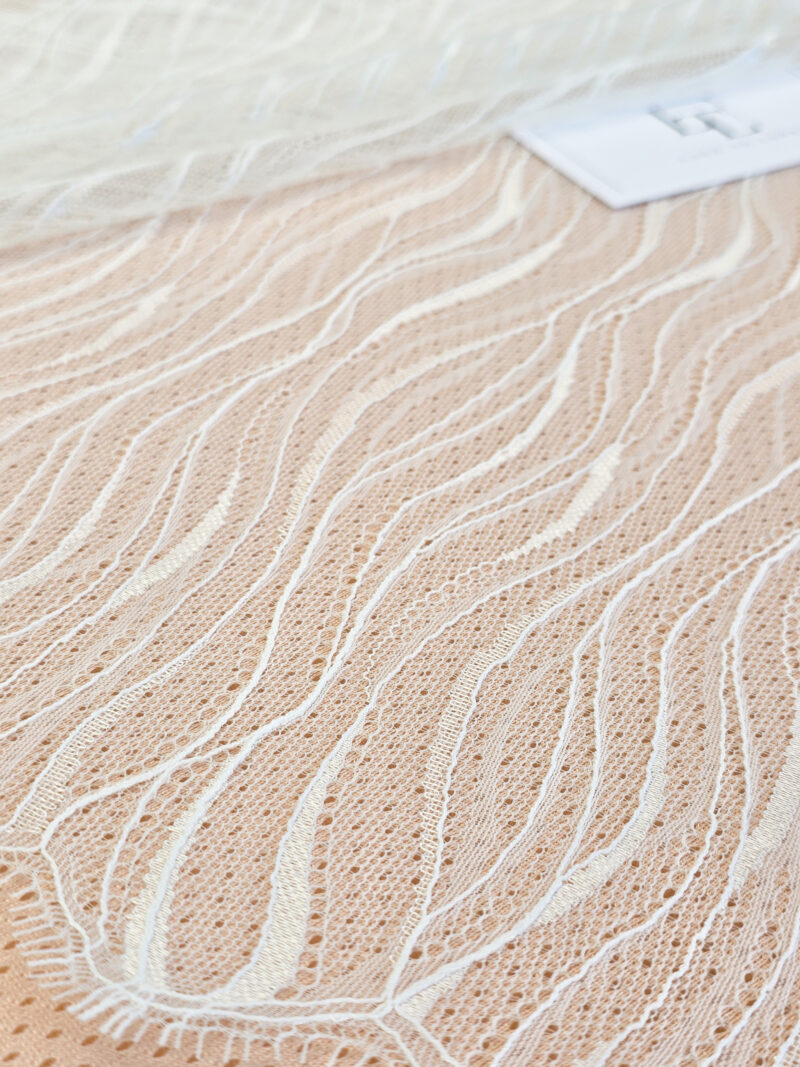 Light ivory geometric lace fabric