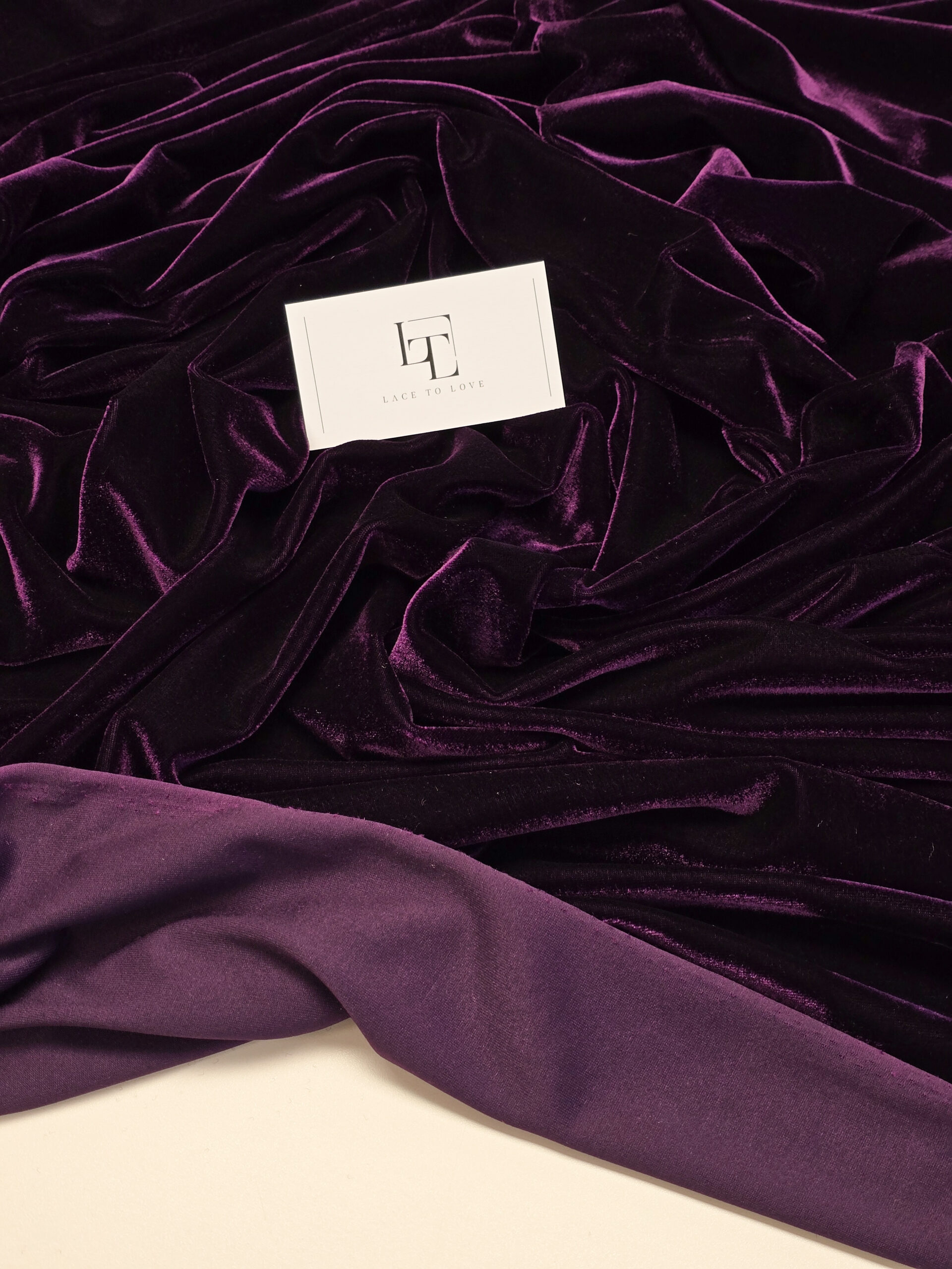 Dark purple smooth stretch velvet velour material