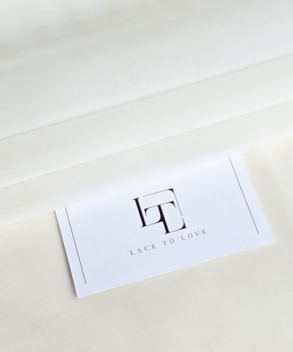 Delicate light ivory tulle fabric