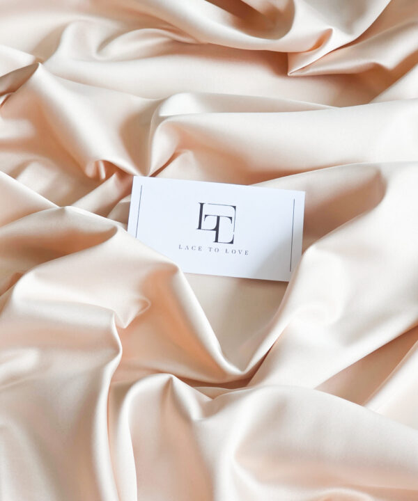 Beige elastic stretch satin fabric