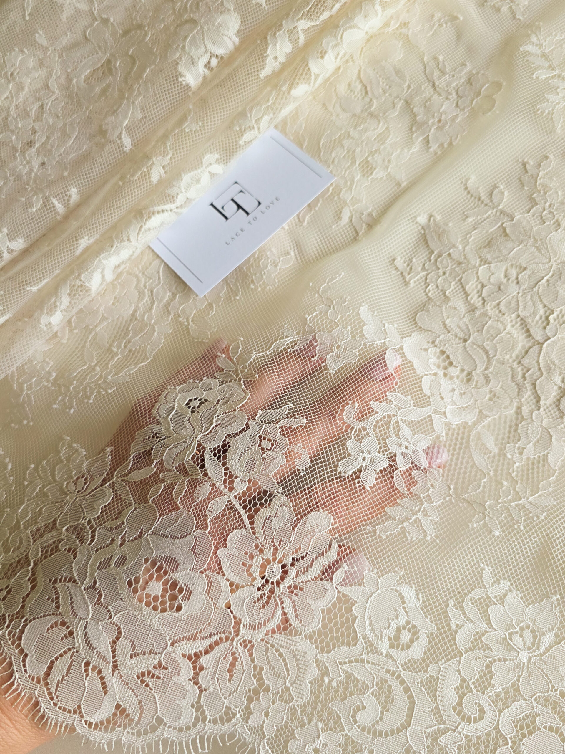 Light beige Chantilly lace fabric