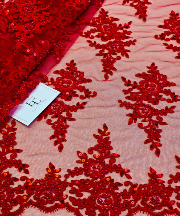 Red lace cloth sold by the yard