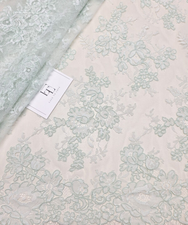Delicate pale green lace fabric
