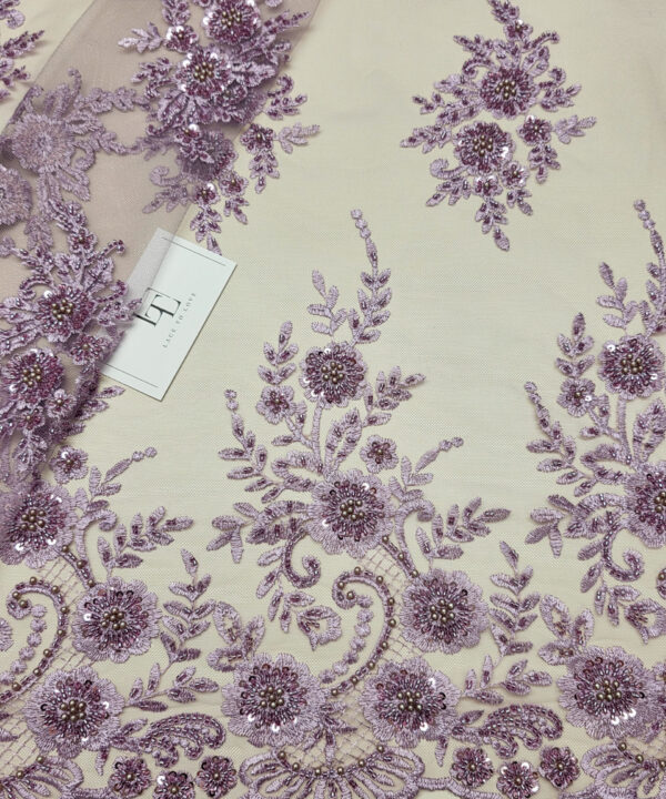 Heavy lilac beaded lace fabric