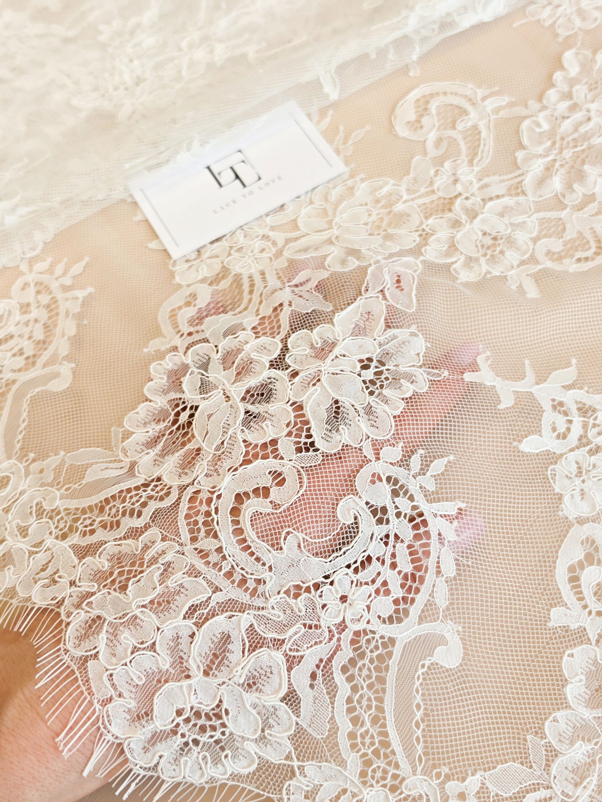 Delicate off white bridal lace fabric