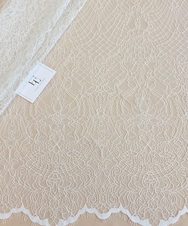 Light ivory Chantilly lace fabric with cord