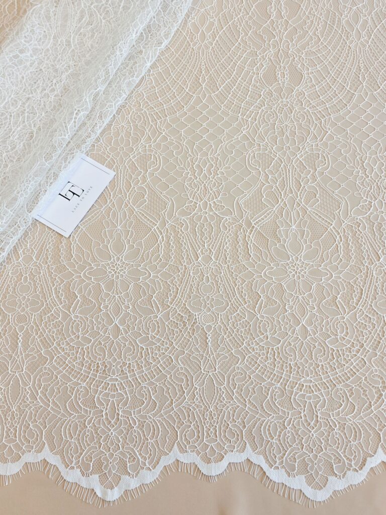 Light ivory Chantilly lace fabric with cord