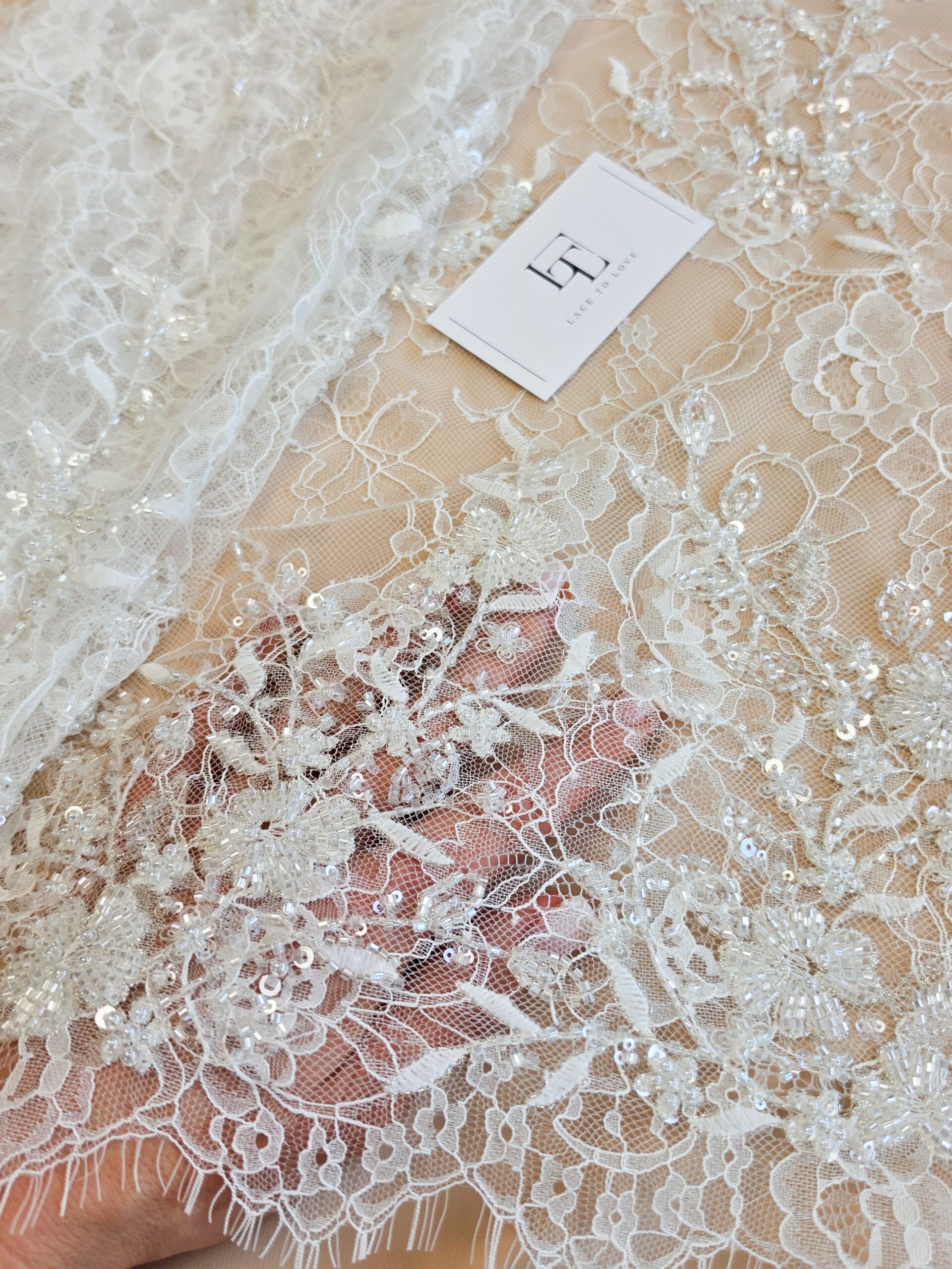 Ivory eyelash lace fabric scalloped borders
